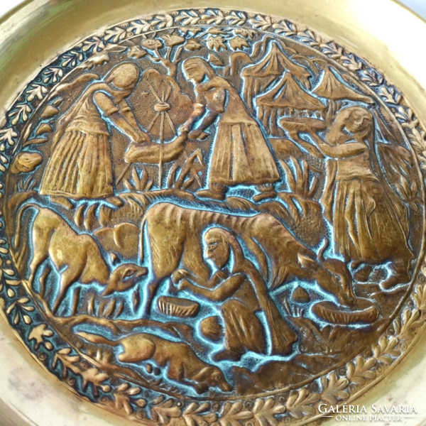Beautiful old hand-hammered brass wall plate