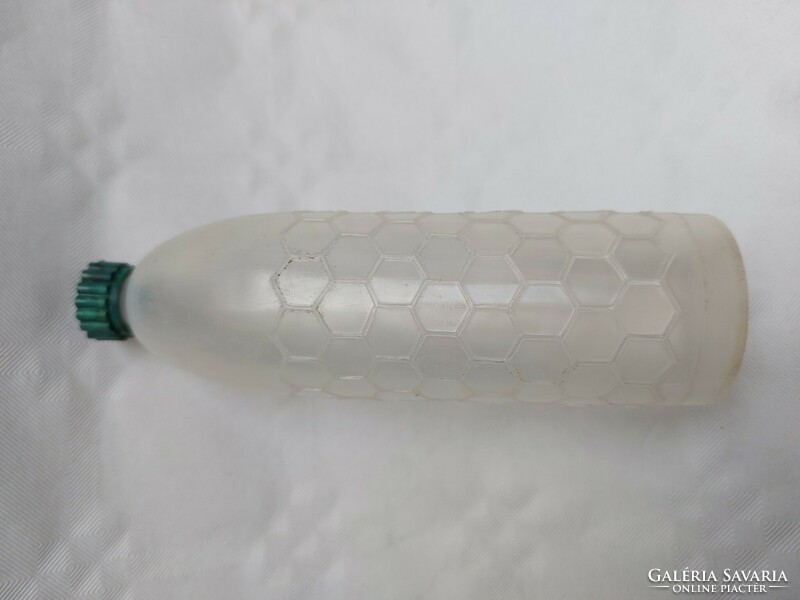 Old honey labeled bottle in retro plastic honey bottle
