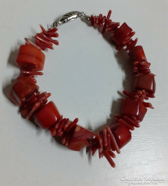 A bracelet made of coral beads in good condition with a silver-plated jewel switch