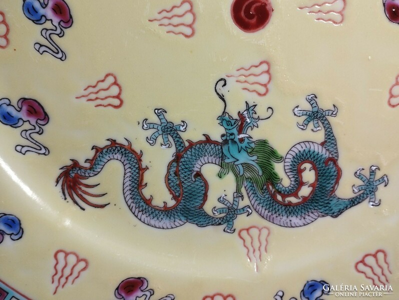 Old Chinese large flat porcelain plate with a dragon