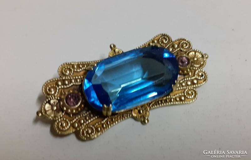 Antique handmade brooch with large polished blue and two pink set stones