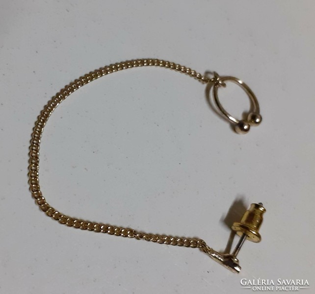 Gold-plated plug-in earrings on a chain in good condition