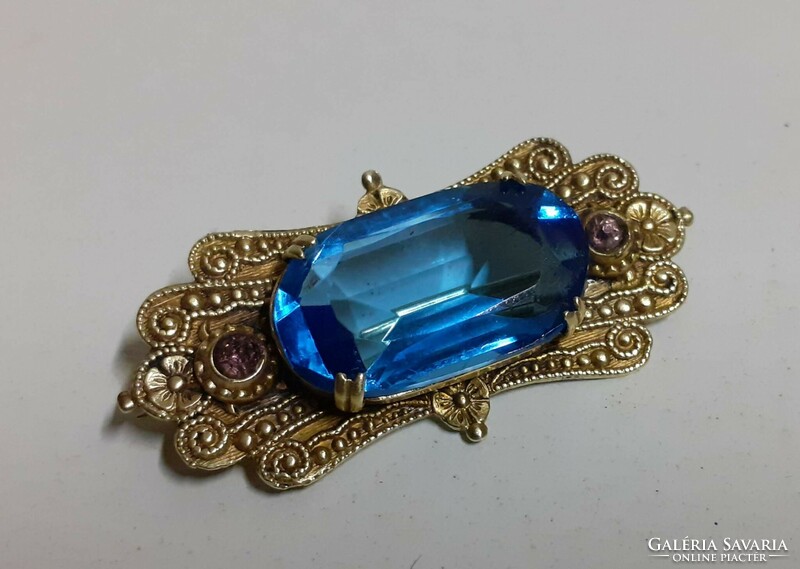 Antique handmade brooch with large polished blue and two pink set stones