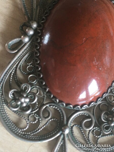 Filigree handmade red jasper medal, on a silver chain-