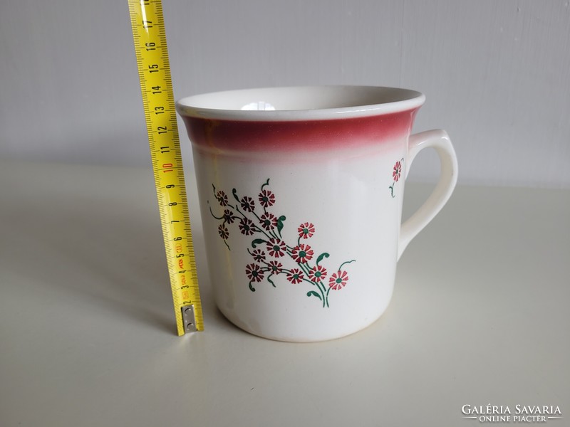 Old large 1-liter granite-tipped folk mug with sour cream and sleeping milk with a floral pattern