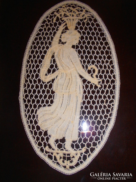 --Antique Brussels lace in a glazed frame.