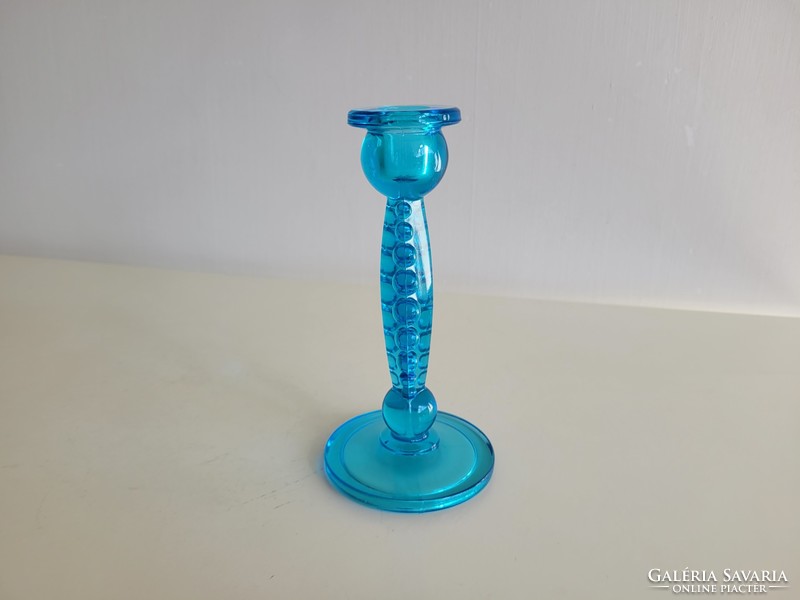 Old blue glass candle holder with beaded glass decoration