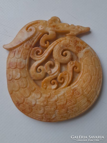 Jadeite pendant with a stylized motif