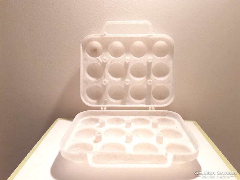 Retro plastic egg cup with old egg storage box