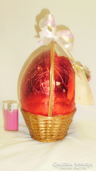 Retro giant Easter chocolate egg in a wicker basket