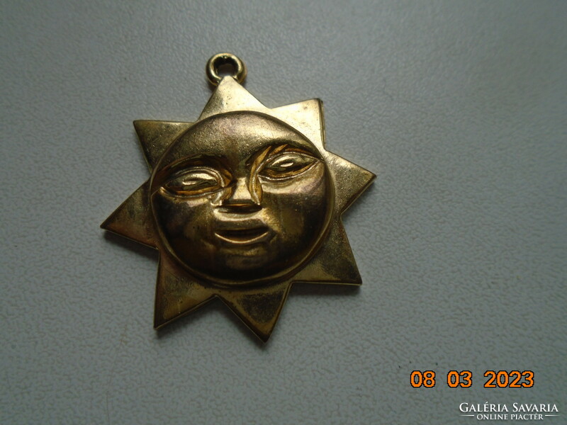 Plastic gold-plated marked sunbeam pendant