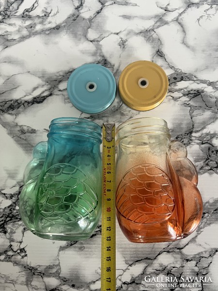 Two pelican-shaped glass lemonade glasses or honey glasses