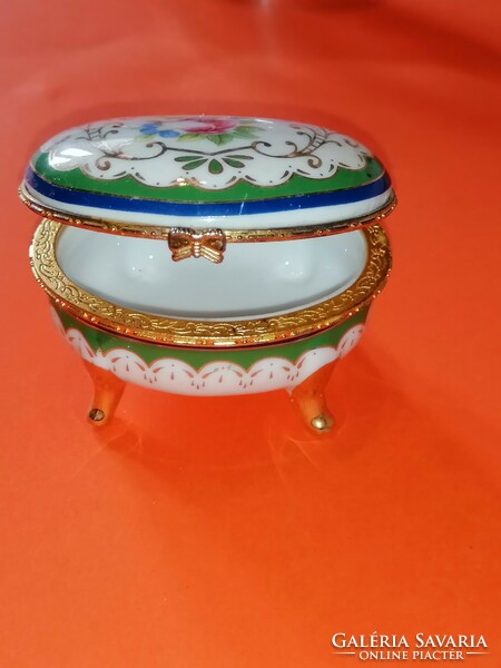 Old, pink jewelry holding porcelain box.