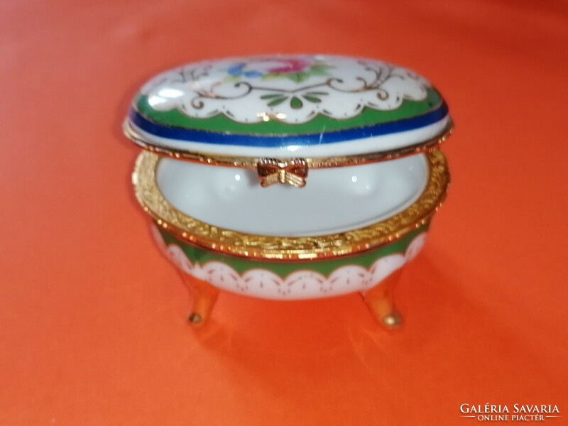 Old, pink jewelry holding porcelain box.