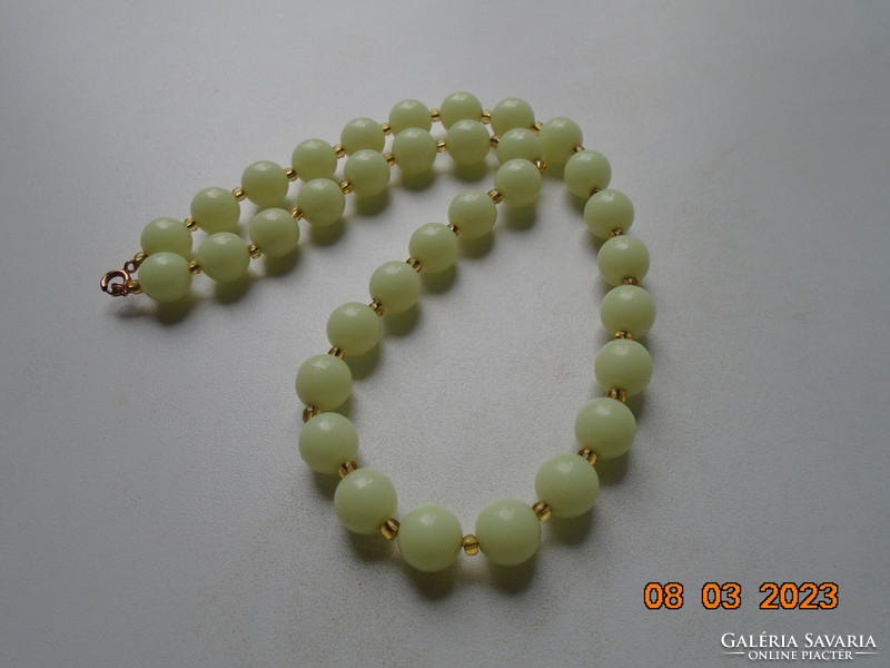Jade-colored, phosphorescent, individually looped pearls with blue gold-plated clasp