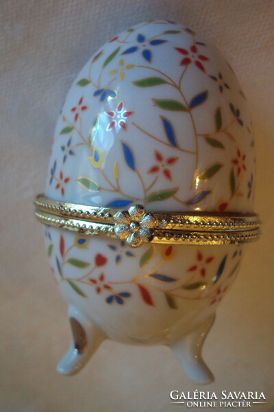 Fabergé-style, 3-legged, flower-patterned, porcelain egg with metal buckle opening.