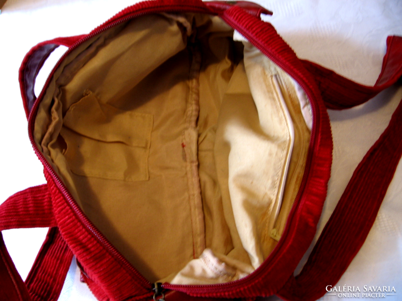 Red cord velvet bag with copper buckles and rivets