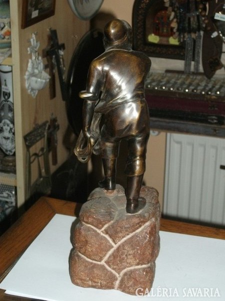 Bronze fisherman figure