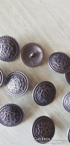 13 beautiful metal buttons with the letter U in a shield