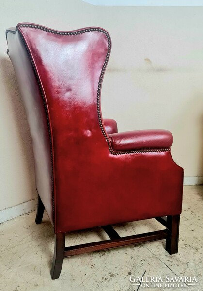 Antique English chesterfield winged leather armchair