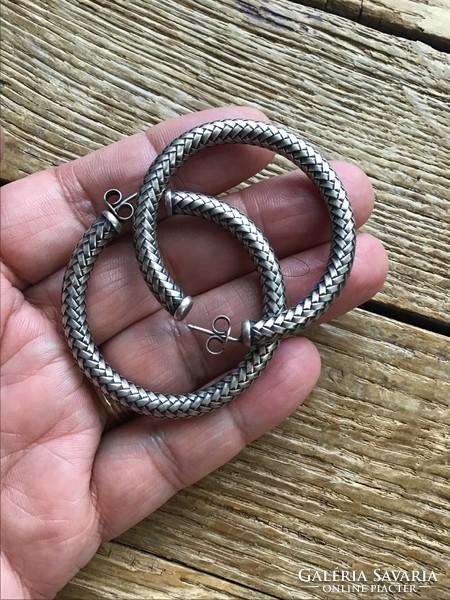 Old silver earrings with braided decoration