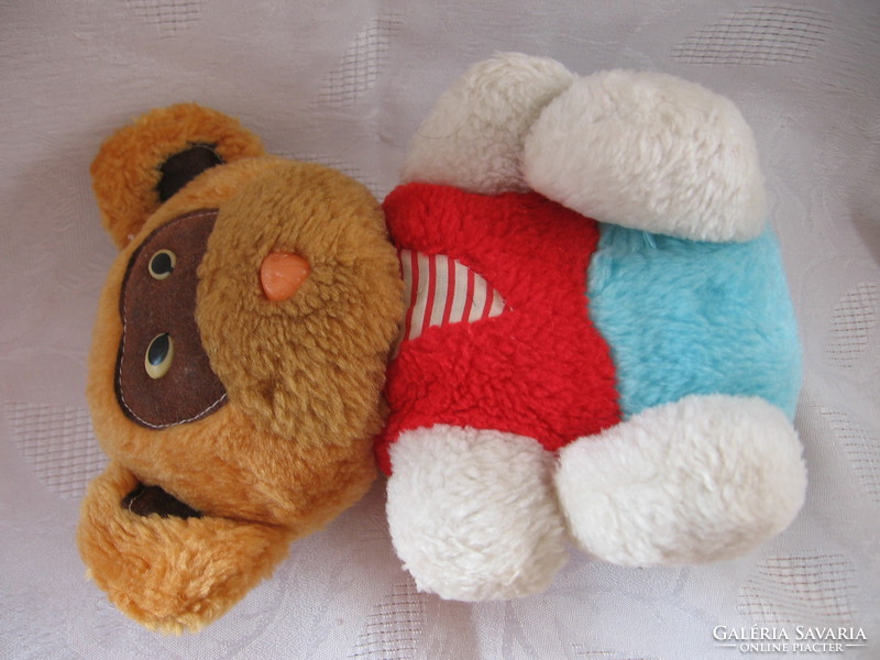 Colorful plush teddy bear in fixed outfit