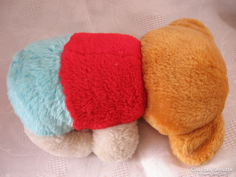 Colorful plush teddy bear in fixed outfit