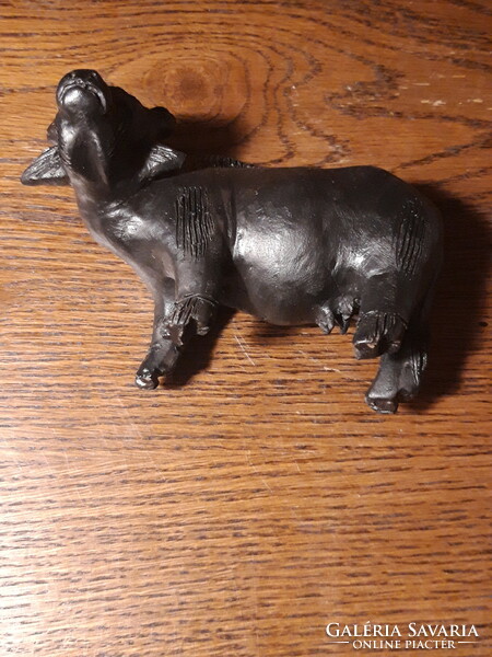 Old painted terracotta buffalo statue