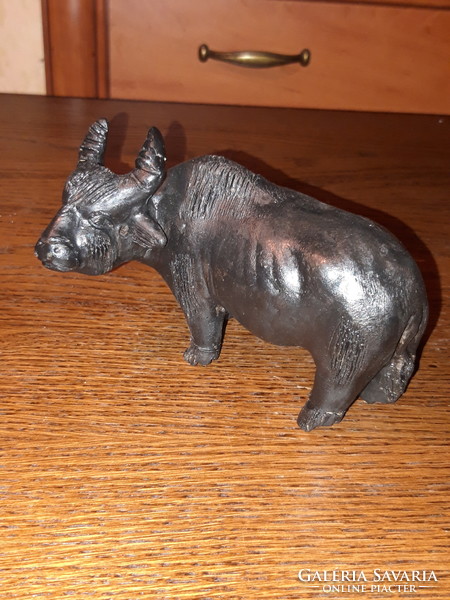 Old painted terracotta buffalo statue