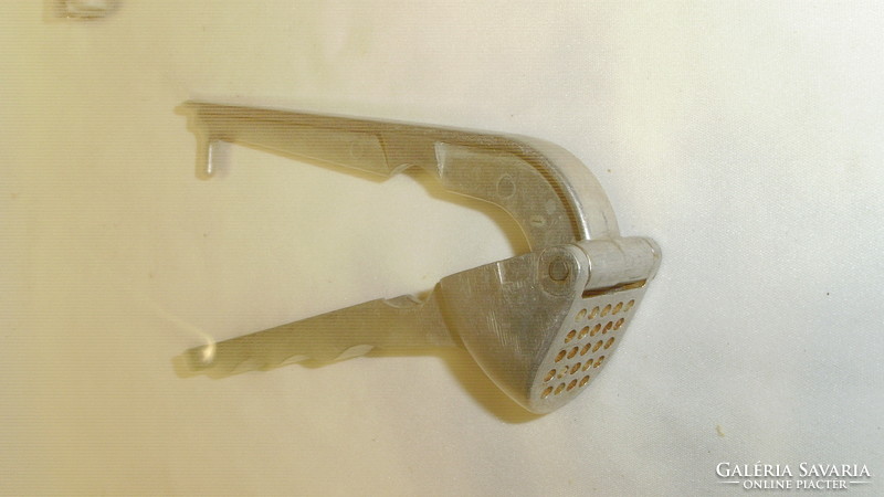 Old garlic crusher and strainer - together