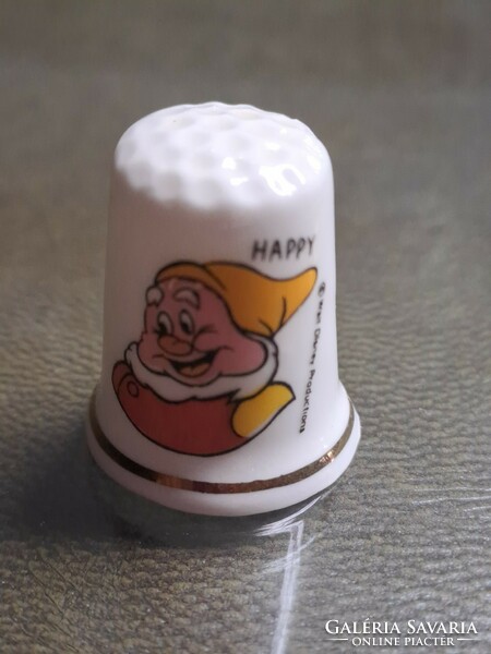 English porcelain thimble with a portrait of an otter, Snow White's happy dwarf