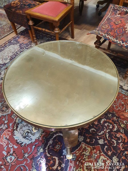 A small wooden table with a glass top.