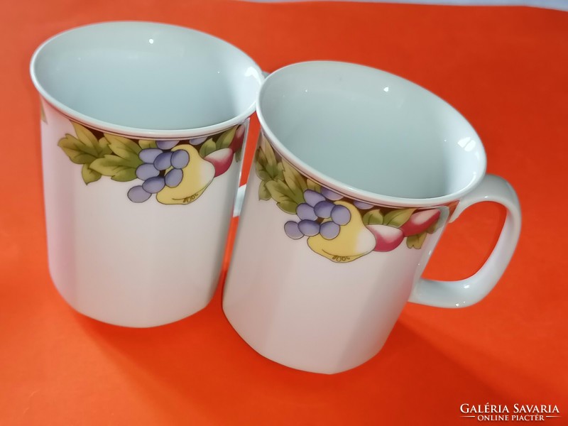 A pair of tasteful retro mugs with a fruit pattern