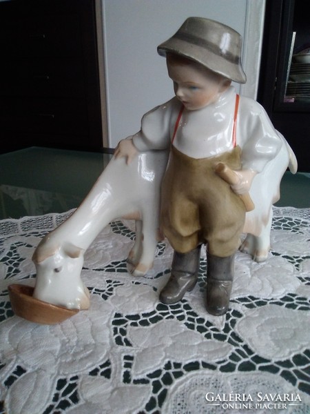 Zsolnay's boy feeding a goat with a shield seal, stamped with a mold number from 1922.