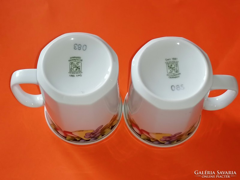 A pair of tasteful retro mugs with a fruit pattern