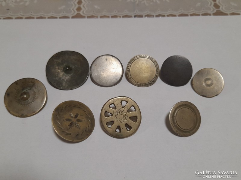 9 antique buttons together