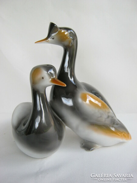A pair of large porcelain birds hand-painted by Raven House
