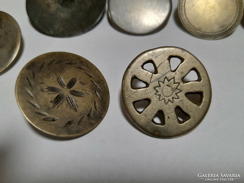 9 antique buttons together