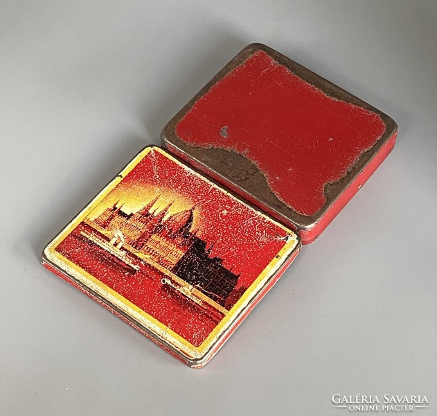 A rarer metal cigarette box with parliament decor, circa 1940
