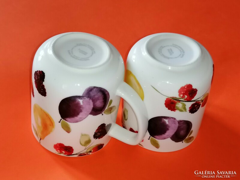 A pair of tasteful mugs with a fruit pattern