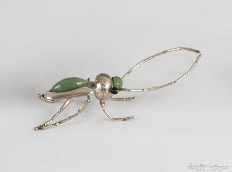 Silver beetle figurine with green stone inlay