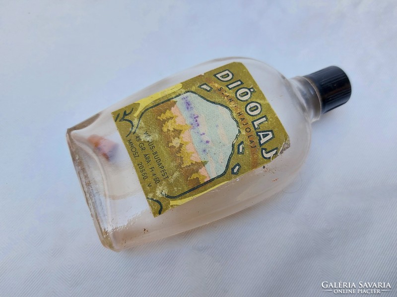 Old labeled essential oil bottle with retro venus walnut oil bottle