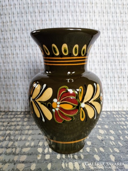 Ceramic vase with a folk motif