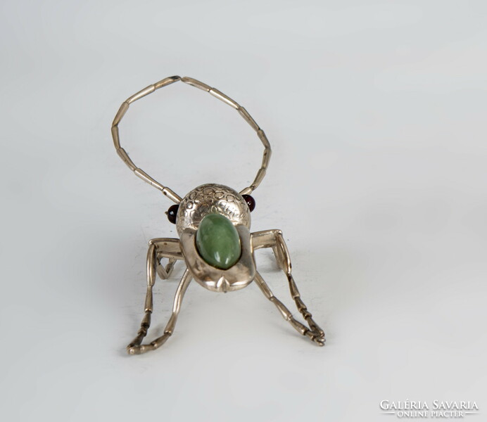 Silver beetle figurine with green stone inlay