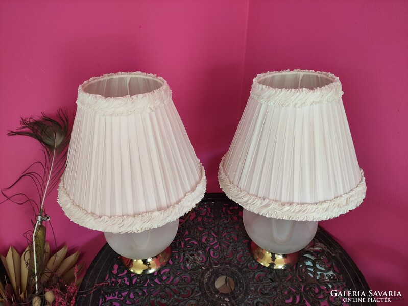 Elegant vintage bedside lamp with a milk glass spherical body and a copper base with a pair of layered white shades