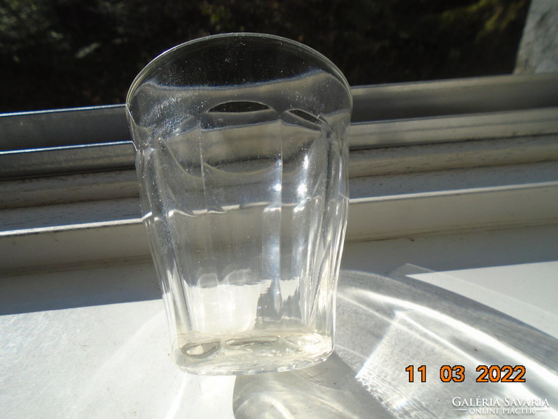 An older molded glass thick-walled ribbed glass with the mark of the Hungarian standards body