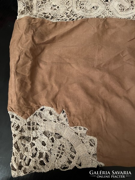 Silk tablecloth decorated with large woven lace
