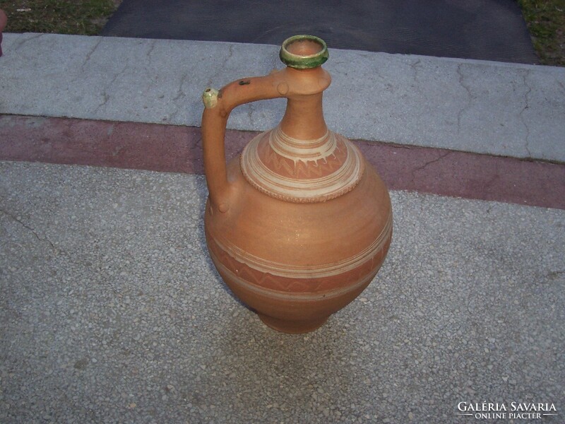 Marked red peter jar is large