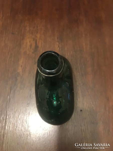 Thick glass bottle, in undamaged condition. Dark green. 19X16 cm