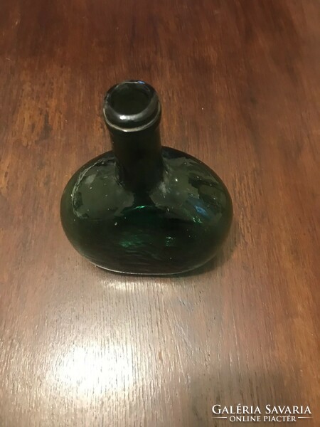 Thick glass bottle, in undamaged condition. Dark green. 19X16 cm